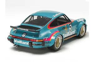 Rear three-quarter view of a completed Tamiya 1/24 scale Porsche 934 Turbo RSR model car in Vaillant teal livery with racing decals.