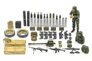A collection of assembled and painted plastic model accessories for a 1/35 scale tank kit, including ammunition, crew figures, weapons, and storage crates.