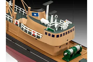 A high-angle close-up of a painted plastic model Northsea fishing trawler showing the bridge, deck equipment, and funnel.