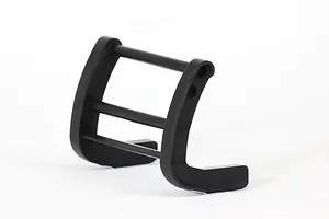 A black plastic RC grill guard accessory for 1/10 scale model cars, shown from a side angle against a white background.