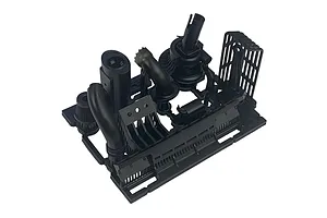 A black plastic sprue containing various RC car muffler and exhaust components for a Pandora RC RWB Rotana body shell.