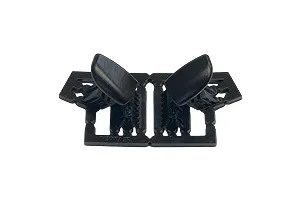 A pair of black plastic RC car door mirrors still attached to their original injection molding sprue frame.