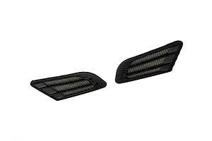 Two black plastic fender duct accessories for 1/10 scale RC car bodies, featuring a mesh grille design.