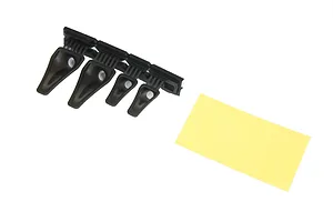 Four black plastic NACA duct parts on a sprue with a small rectangular yellow adhesive sheet on a white background.