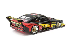 A 1/24 scale model of a 1978 Ford Zakspeed Capri Turbo, featuring a black, yellow, and red Mampe racing livery, viewed from the rear three-quarter angle.
