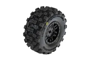 A single Pro-Line Badlands MX tyre mounted on a black Split Six rim, shown against a white background.
