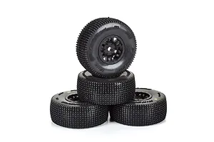 A stack of four black Pro-Line King Pin RC tyres pre-mounted on black Split Six rims against a white background.