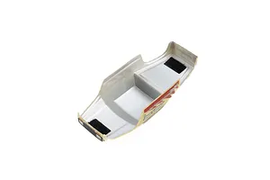 Underside view of a Pro-Line Coyote RC body shell showing the silver interior, velcro mounting strips, and printed exterior graphics.