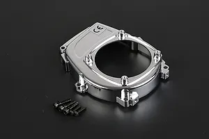 A chrome-plated Rovan engine cover for an RC car, shown with five small black mounting screws on a dark background.
