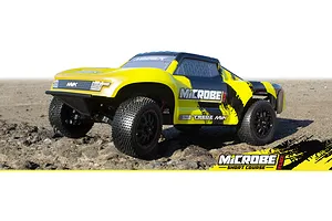 A yellow and black Maverick MiCROBE SC Flux RC short course truck parked on a dirt surface.
