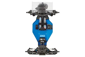 Top-down view of a Team Associated RB10 RC buggy chassis featuring a blue anodized aluminum main plate, Reedy electronics, and black plastic suspension components.