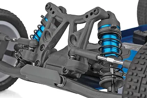 Close-up of the front suspension and blue anodized shock absorbers on a Team Associated RC buggy.