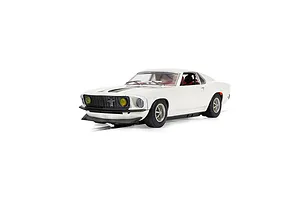 A 1/32 scale Scalextric Ford Mustang slot car in white with black racing stripes, featuring yellow headlights and a detailed interior.