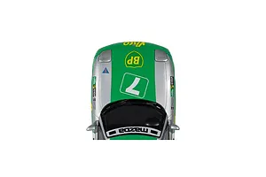 Top-down view of a Scalextric 1/32 scale Mazda RX-7 FD slot car in green and silver livery with number 7 racing decals.