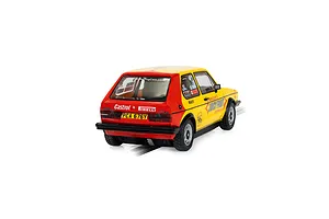Rear three-quarter view of a Scalextric 1/32 scale Volkswagen Golf MK 1 slot car in yellow and red livery with Juicy Fruit and Castrol branding.