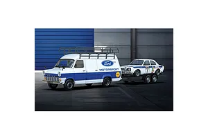 A Scalextric 1/32 scale Ford Transit MK1 van towing a Ford Escort MK1 race car on a trailer, both featuring Ford Motorsport livery.