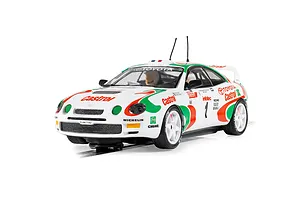 Scalextric 1/32 scale Toyota Celica GT-Four rally slot car in white with Castrol red and green livery on a track.