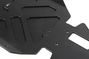 A close-up view of a black anodized aluminium RC main chassis plate with various cutouts and mounting holes.