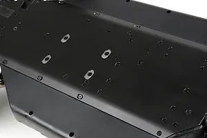 A close-up view of the black anodized aluminium main chassis plate for a Rovan LT RC vehicle, showing the underside with numerous screw holes.