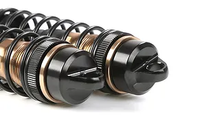 Two Rovan aluminium front adjustable RC shock absorbers in bronze and black finish, shown close-up against a white background.