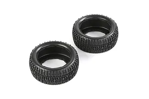Two black rubber RC short course truck tyres with a blocky tread pattern, shown from an elevated angle on a white background.