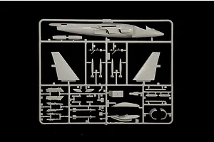 A grey plastic sprue containing various parts for an Italeri 1/72 scale AV-8B Harrier II model kit, including fuselage and wing components.