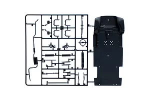 A black plastic sprue containing various model car parts, including a chassis floor pan and suspension components, for an Italeri 1/24 Ford Transit model kit.