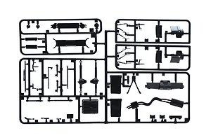 A black plastic sprue containing various unpainted model car parts for an Italeri 1/24 scale Range Rover model kit.