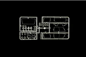 A clear plastic sprue containing various transparent model car parts, including windows and light lenses, set against a black background.