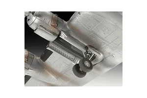 Close-up of the landing gear and wing section of a silver Lockheed L-1049G Super Constellation model aircraft.