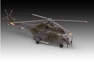 A completed 1/144 scale plastic model of a Westland Puma HC.1 helicopter in Royal Air Force green camouflage livery.