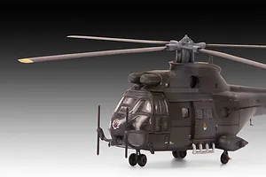 A side-profile view of a completed 1/144 scale plastic model of a Westland Puma HC.1 helicopter in dark green military camouflage.