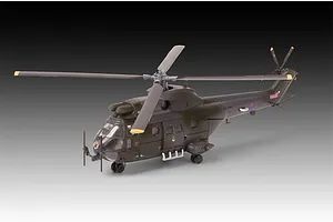 A completed 1/144 scale plastic model of a Westland Puma HC.1 helicopter in dark olive green military livery, shown against a gradient background.