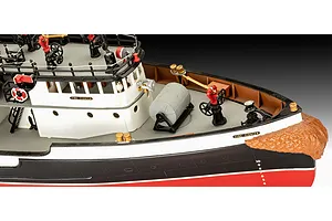 Close-up of the bow and deck of a Revell 1/87 scale Fire Fighter model boat, showing detailed water cannons, railings, and hull markings.