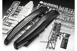 Unassembled plastic model kit parts for a ship, including large black hull sections and various white and black sprues on a white surface.