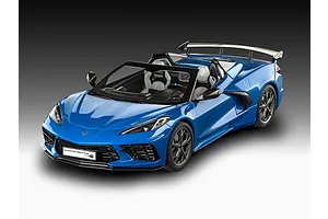 A high-angle studio shot of a completed Revell 1/25 scale Corvette C8 Cabriolet model car, finished in bright blue with a detailed interior.