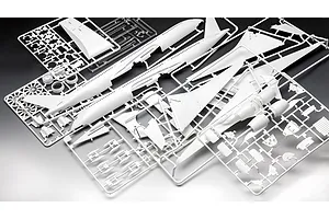 White plastic model aircraft kit sprues for a Revell A350-900 model, including fuselage halves, wings, and engine parts on a dark background.