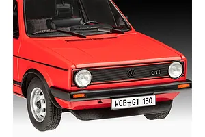 A close-up front view of a red 1/24 scale model Volkswagen Golf GTi, showing the grille, headlights, and license plate.