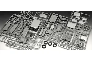 Grey plastic model kit sprues for a 1/24 scale VW Golf GTi, including car body, interior parts, and rubber tires on a dark background.