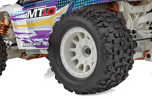 Close-up of the Team Associated Rival MT10 RC monster truck showing the white wheel, knobby tire, and colorful body shell graphics.