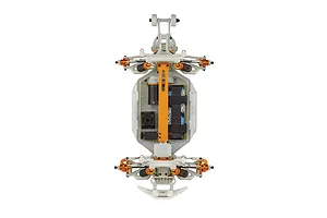 Top-down view of a Team Associated Rival MT10 RC monster truck chassis showing the white plastic frame, orange anodized aluminum parts, and electronics.