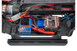 Top-down view of a Traxxas RC car chassis interior showing the Pro Scale Lighting Power Module installed next to the XL-5 HV electronic speed control.
