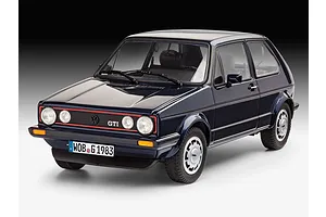 A studio shot of a completed 1/24 scale Revell model kit of a dark blue 1983 Volkswagen Golf GTI Pirelli edition.