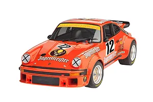 A completed 1/24 scale plastic model of a Porsche 934 RSR in orange Jägermeister racing livery with number 12 decals.