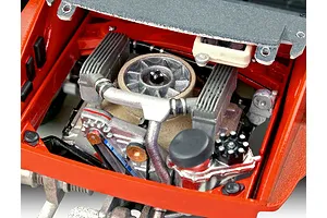 Close-up of a detailed scale model car engine bay, showing the air-cooled flat-six engine components painted in red, silver, and black.
