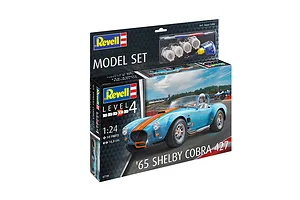 Revell 1/24 scale '65 Shelby Cobra 427 plastic model kit box, featuring a blue and orange race car on the packaging, including paints and glue.