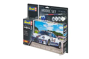 Revell 1/24 scale Porsche 934 RSR Martini model kit in blister packaging with included paints, glue, and brush.