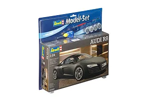 Revell 1/24 scale Audi R8 plastic model car starter kit in original blister packaging with included paint, glue, and brush.