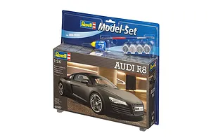 Revell 1/24 scale Audi R8 plastic model starter kit in blister packaging, including paint pots, glue, and a paintbrush.