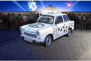 An artistic illustration of a white Trabant 601S model car decorated with peace symbols and doves, parked in front of a crowd at the Brandenburg Gate.